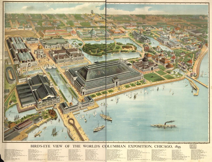 Panoramic view of elaborate buildings of the World's Columbian Exposition, interspersed by waterways, green spaces, and prominent boats on Lake Michigan.