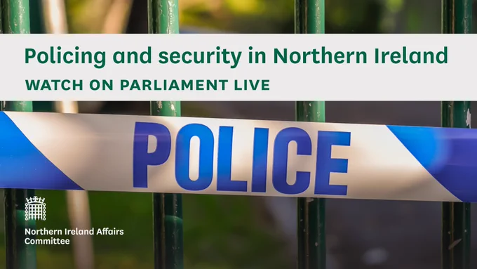 Policing and security in Northern Ireland.
Watch on Parliament Live.
Northern Ireland Affairs Committee.
Photo shows a close up of police tape across a close up of a park green fence.