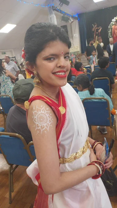 Sneha is south asian and in this photo she wears traditional dress 