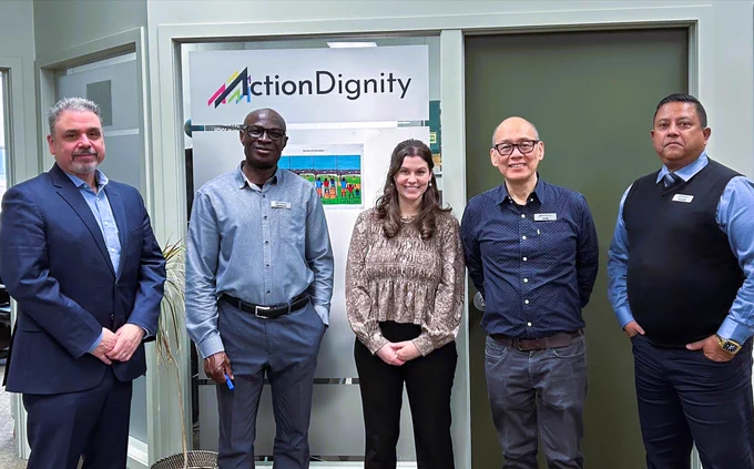 Deputy Ombudsman Mike Good and staff gather with representatives from ActionDignity during a community meeting.