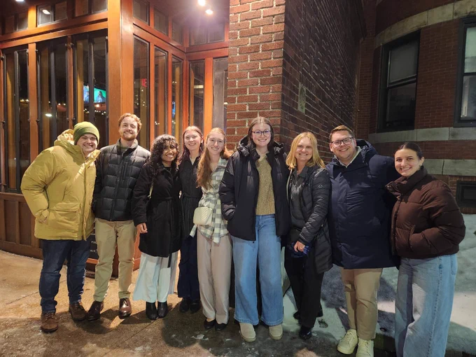 group of people photographed outside restaurant