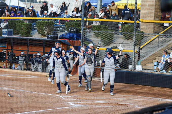 Nevada exiting the dugout to celebrate a home run