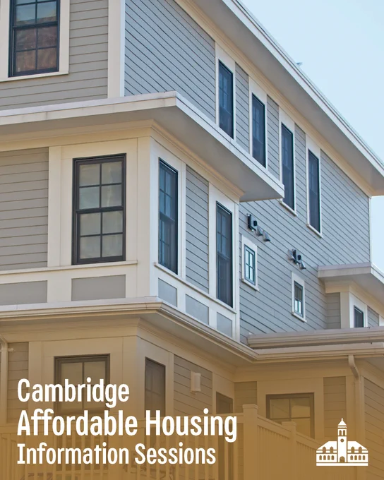 Image of a grey housing building with large windows with white trims.