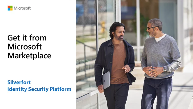 Two male colleagues, one holding a Surface Pro device, discuss strategy while walking outside an office. Text reads: "Get it from Microsoft Marketplace. Silverfort Identity Security Platform."