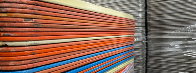 Stacks of plastic and metal trays and Surplus
