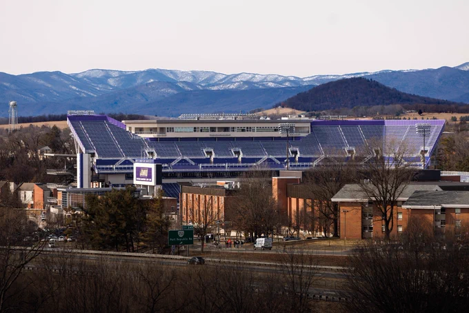 Bridgeforth Stadium stands in front of distant snow-covered mountains.