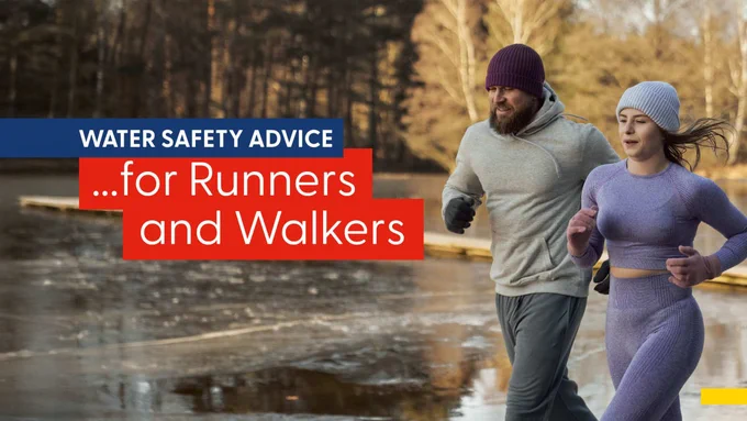A person in a gray outfit and another in a purple outfit are jogging alongside a frozen lake surrounded by trees. The image includes the text: "Water Safety Advice...for Runners and Walkers."