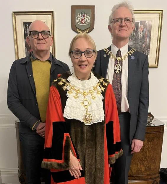 The Mayor of Trafford, Jane Brophy, standing in the centre, flanked by her husband and consort John on her left, and Minister Ashley Hardingham, the Mayor’s Chaplain for her term of office, on her right.