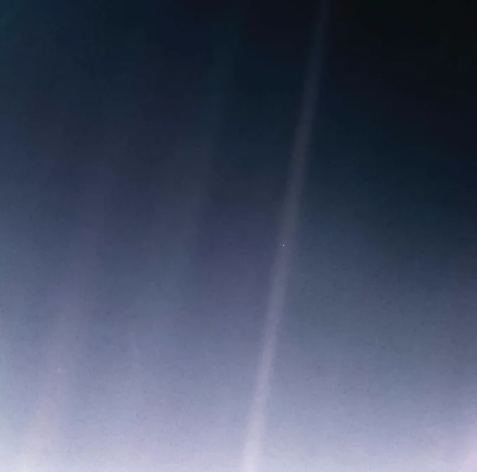 The Pale Blue Dot is a photograph of Earth taken Feb. 14, 1990, by NASA\u2019s Voyager 1 at a distance of 3.7 billion miles (6 billion kilometers) from the Sun. The image inspired the title of scientist Carl Sagan's book, \"Pale Blue Dot: A Vision of the Human Future in Space,\" in which he wrote: \"Look again at that dot. That's here. That's home. That's us.\" This image, \u201CPale Blue Dot Revisited,\u201D was created in 2020 for the 30th anniversary of the iconic picture. The updated version used modern image-processing software and techniques to revisit the well-known Voyager view, while attempting to respect the original data and intent of those who planned the images.