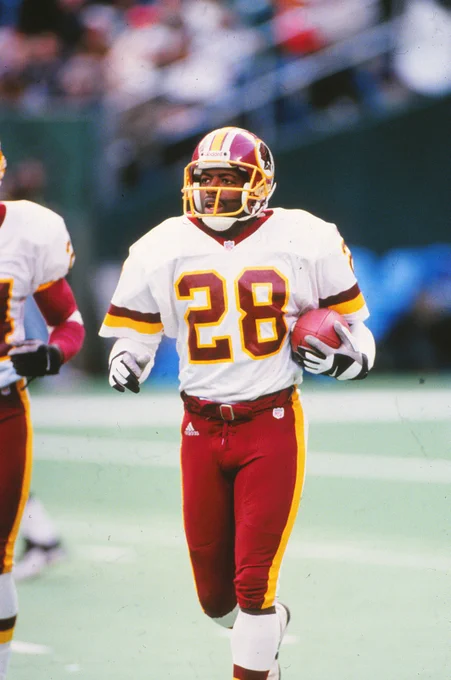Photo of Darrell Green playing football.