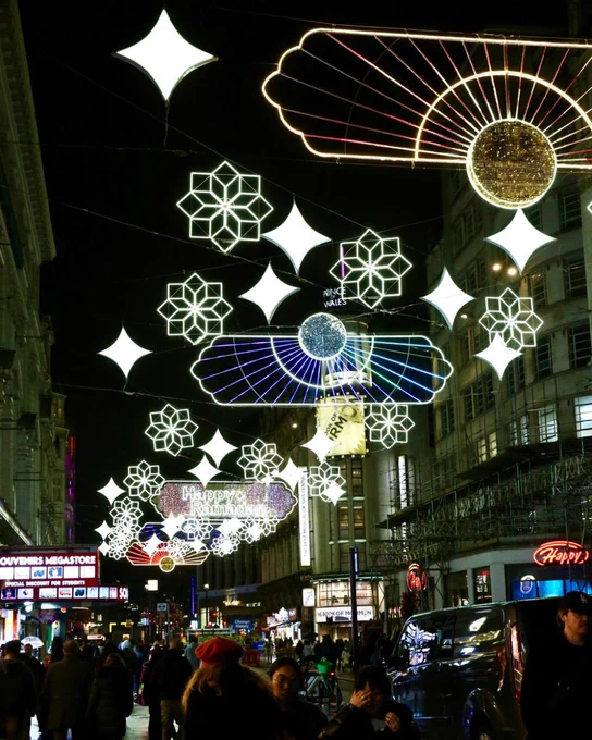 A street with Ramadan lights hanging between the buildings