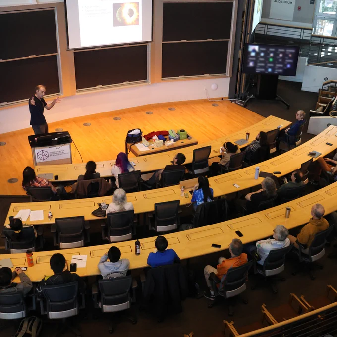 Francis Nimmo, Professor of Earth and Planetary Sciences at UC Santa Cruz, speaking in front of a crowd at the Simons Laufer Mathematical Sciences Institute at UC Berkeley.