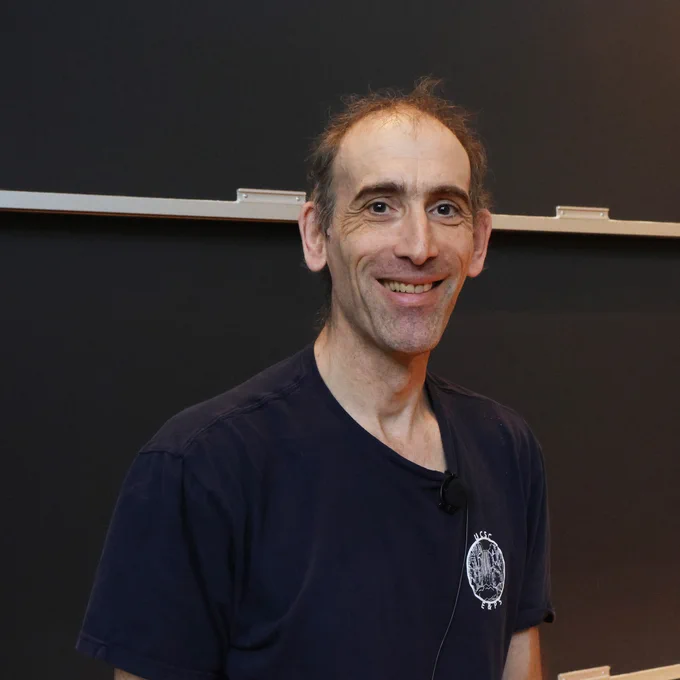 Francis Nimmo, Professor of Earth and Planetary Sciences at UC Santa Cruz, smiling for a photo after a talk at the Simons Laufer Mathematical Sciences Institute at UC Berkeley. 