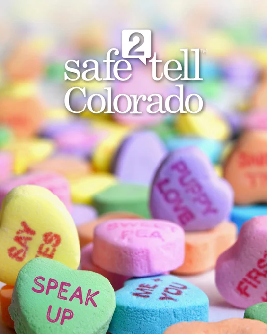 Colorful candy hearts with messages like "SPEAK UP" and "PUPPY LOVE" are scattered in the foreground. The logo for "Safe2Tell Colorado" is prominently displayed at the top of the image.