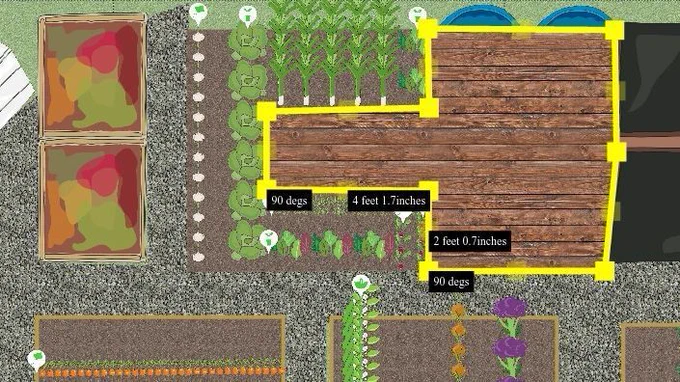 a screen shot of a vegplotter garden plot showing a composts, raised bedss of veg and  measuring out a decking area