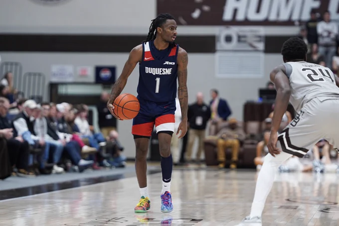 TG dribbling down court