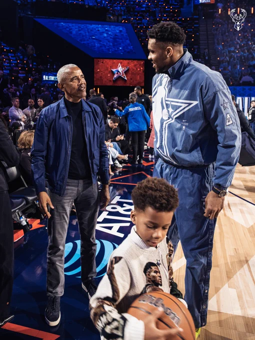 A photo of Giannis Antetokounmpo and former President Barack Obama courtside at the All-Star Game in Los Angeles.