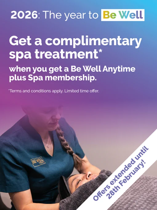 A graphic with a purple ombre overlay that says '2026: The year to Be Well. Get a complimentary spa treatment* when you get a Be Well Anytime plus Spa membership. *Terms and conditions apply. Limited time offer.' There is a white ribbon banner in the bottom left hand corner that says 'Offers extended until 28th February!'. There is a photo of a spa therapist giving a woman a facial treatment.