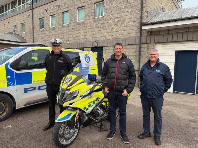 Motorcyclists across Scotland can now enrol in Rider Refinement courses for 2026 and enhance their rider skills and road safety knowledge. Image shows branded Police Scotland van and motorbike with Superintendent Andrew Barclay, Andrew Stewart And IAM RoadSmart’s Stewart Mackie standing facing the camera.