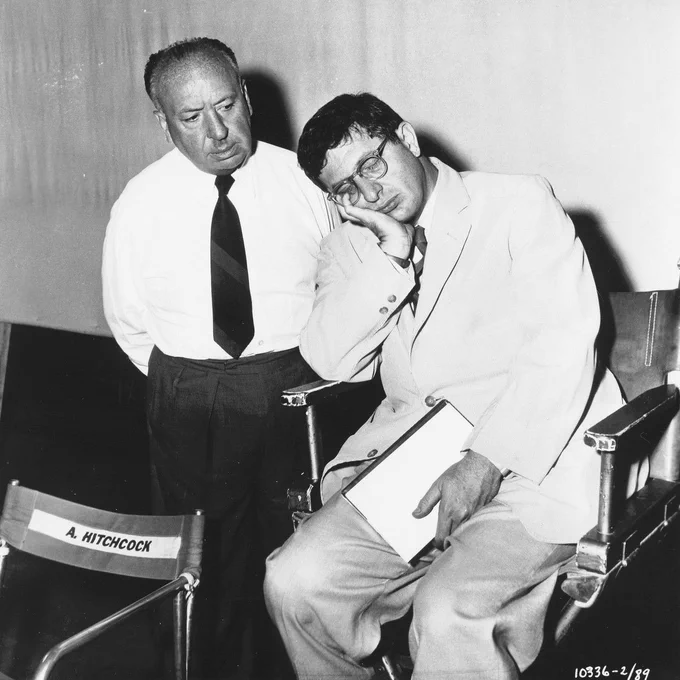 Alfred Hitchcock and Bernard Herrmann on the set of THE MAN WHO KNEW TOO MUCH in 1955.