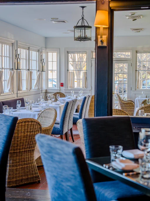 A wide shot of a fancy dining room with a cozy atmosphere