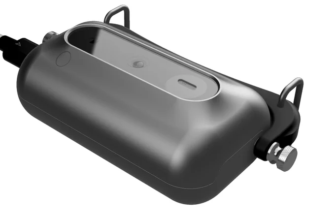 Petpin V0 collar-mounted wearable device front side view showing the camera lens, microphone, and other external sensors.