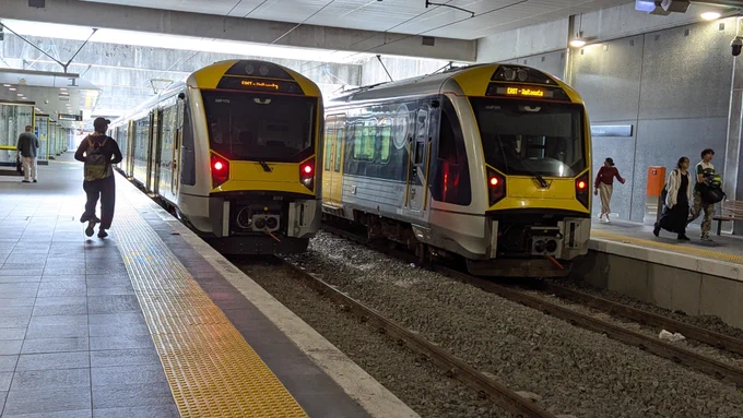 Two trains sitting at Manukau railway station