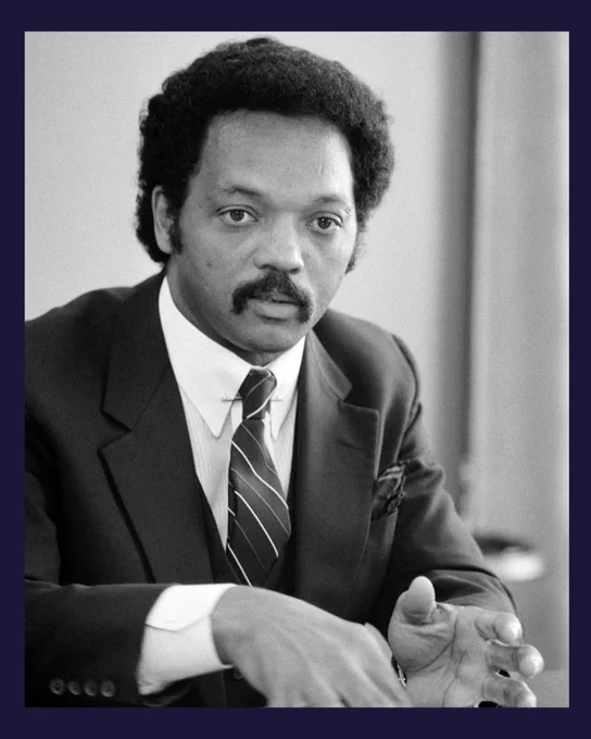 A photo of Rev. Jesse Jackson speaking during an interview in July 1983.