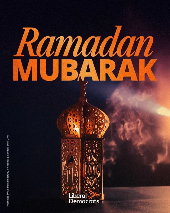 A graphic of a glowing decorative lantern on a dark background. Large orange text at the top reads “Ramadan Mubarak.” At the bottom is the logo and name “Liberal Democrats" in orange.
