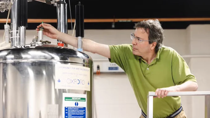 Lewis Kay feeds protein molecules into a giant magnet in his U of T lab