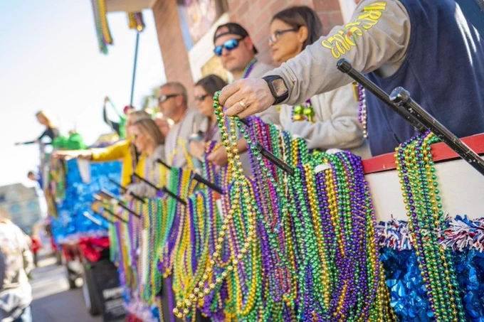 Throwing Mardi Gras beads