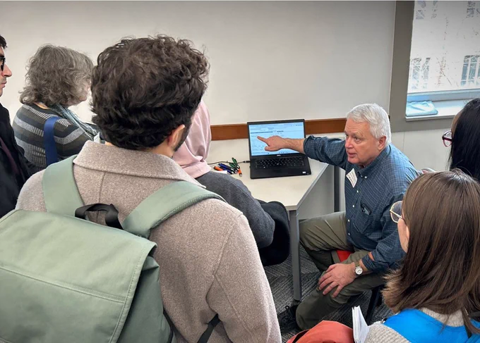 Steve McClaskie, research sr. associate at CHRR at The Ohio State University, meets with students to answer data questions and show them how to use a web tool to access free, public data from the National Longitudinal Surveys (NLS). McClaskie also is a user services rep for the NLS, which is a key program of the Bureau of Labor Statistics.
