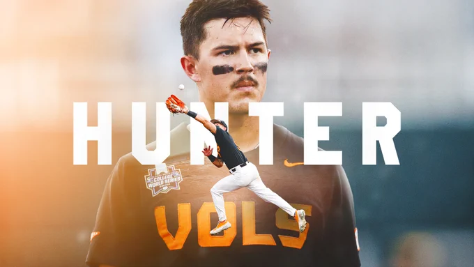 Poster of a baseball player in a gray shirt with text in orange that says V-O-L-S with black marks on his cheeks. The poster for the documentary titled Hunter.