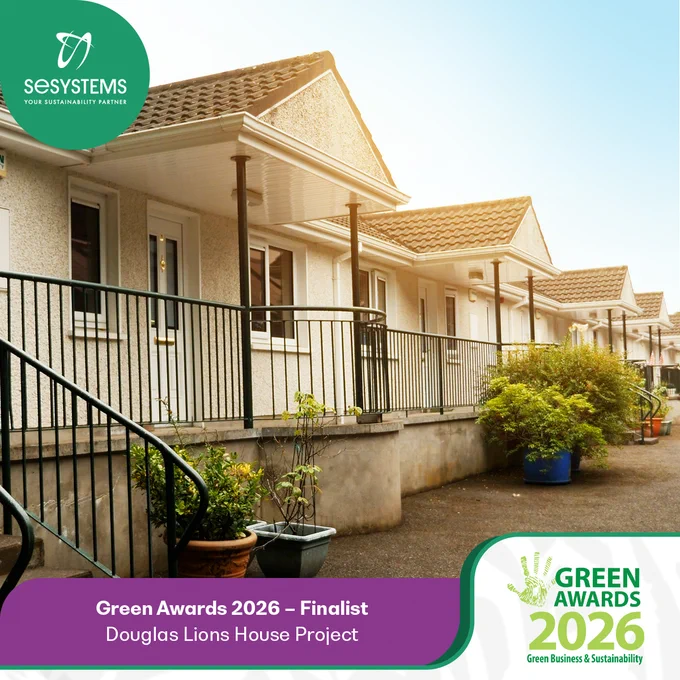 Row of newly renovated residential units with cream exterior walls, tiled roofs and black railings, featured in a branded SE Systems graphic announcing Green Awards 2026 – Finalist for the Douglas Lions House Project, with the Green Awards 2026 logo displayed.
