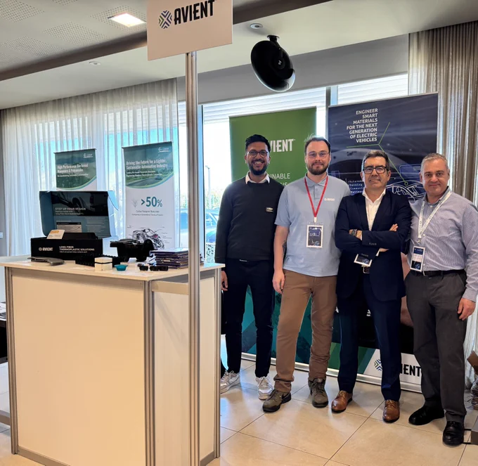 Avient associates standing in front of a tradeshow booth
