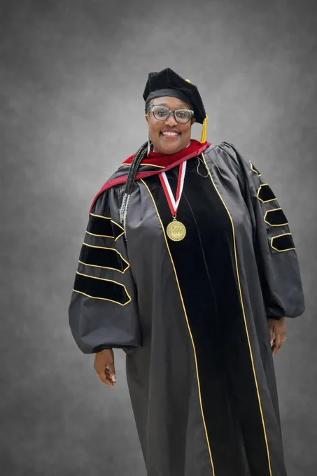 Photo of Linda Davis at a graduation ceremony