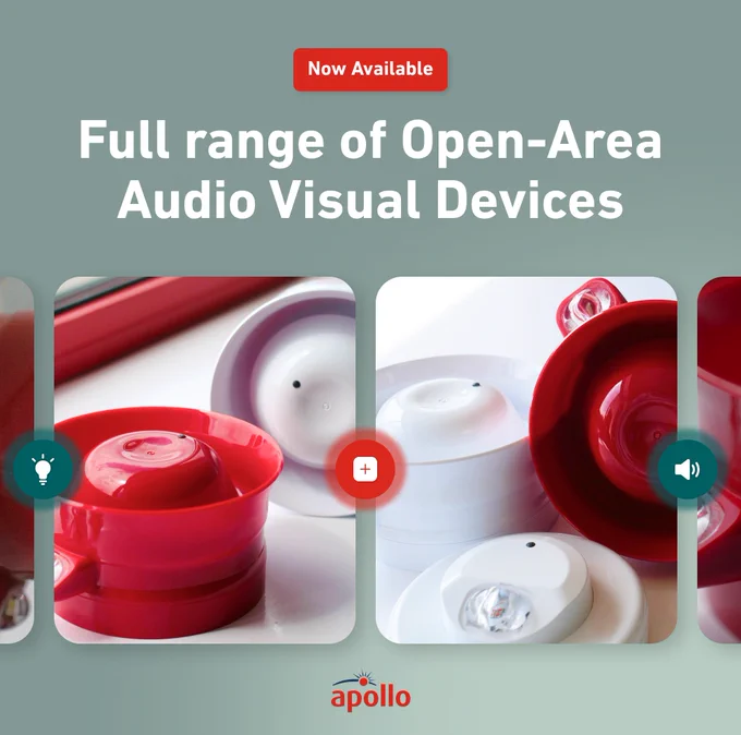 Close-up of red and white open-area audio visual devices displayed on a light surface.