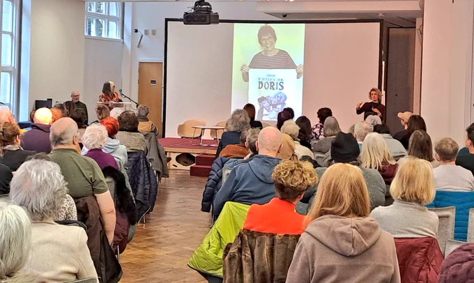 Audience facing screen of comic images 