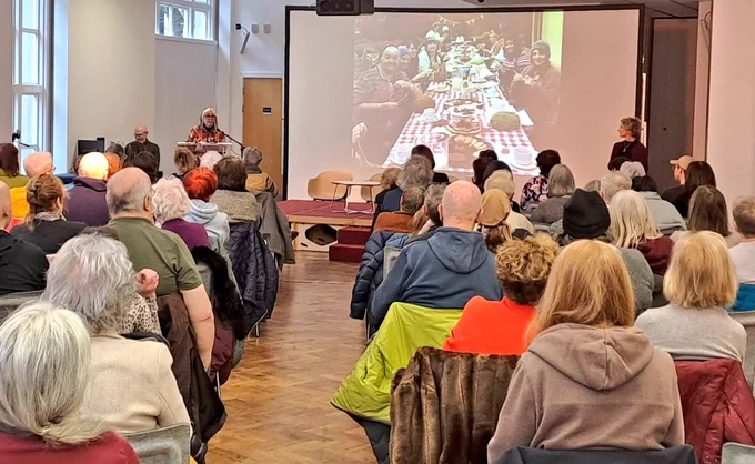 Audience facing screen of comic images 