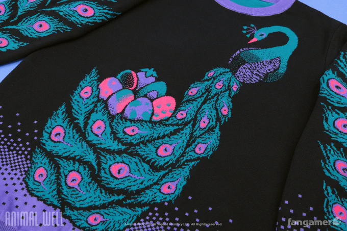 A closeup photo of the Peacock's Treasure Animal Well sweater, showing the way the peacock design begins near the collar with the animal's graceful head and neck and extends toward the waist with a nest filled with a variety of eggs emerging from its plumage. It's a black knit sweater with a dithered purple gradient at the waist and the cuffs and a pink, turquoise, and purple peacock design on the chest and sleeves.