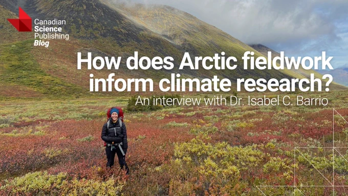 Researcher standing in colorful Arctic tundra with mountains in the background during fieldwork for climate studies.