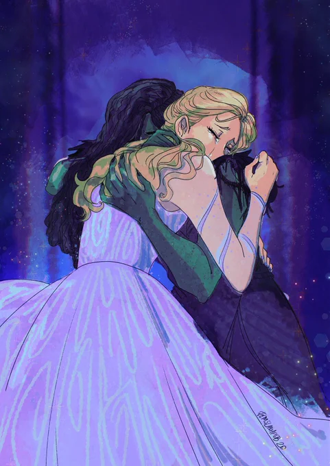 Glinda and Elphaba in their outfits from "Wicked: For Good", clutching onto each other tightly as they cry into each other's shoulders. 
