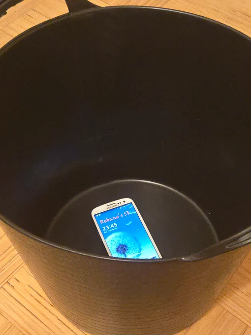A physical bucket with the Samsung Galaxy S3 phone in it