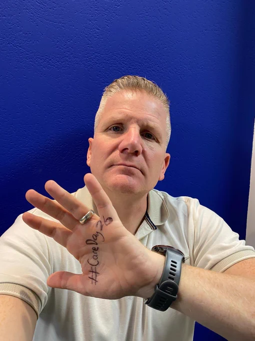 Commissioner Chris Quinn in a series of pictures with a variety of expressions on his face and #CareDay26 written on the palm of his hand.