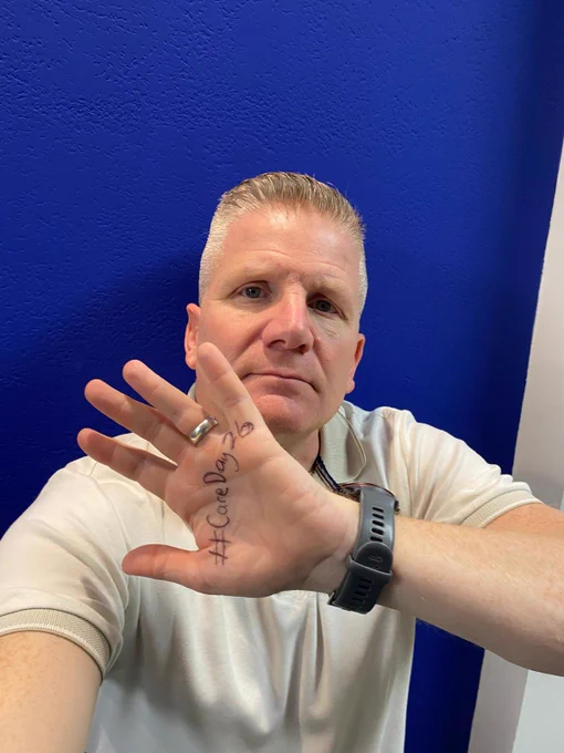 Commissioner Chris Quinn in a series of pictures with a variety of expressions on his face and #CareDay26 written on the palm of his hand.