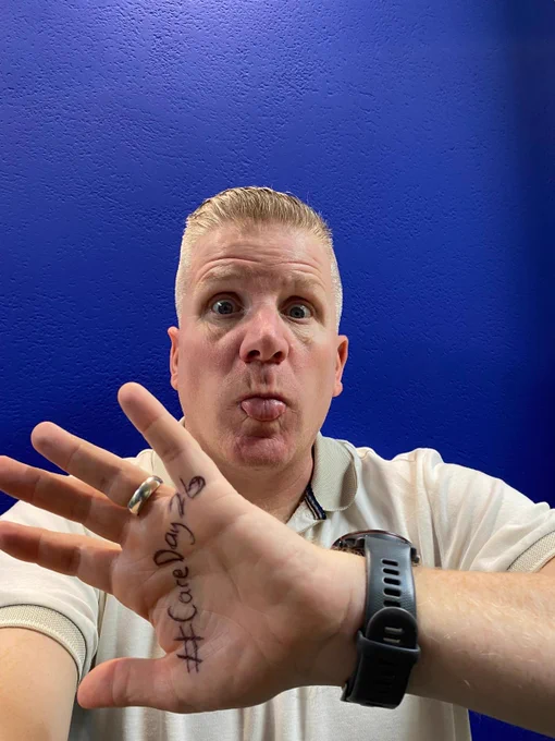 Commissioner Chris Quinn in a series of pictures with a variety of expressions on his face and #CareDay26 written on the palm of his hand.