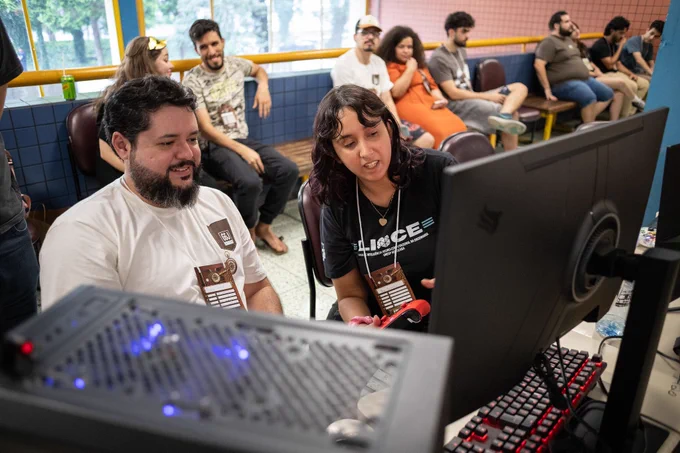 Jammers in front of PC at Global Game Jam Curitiba 2026