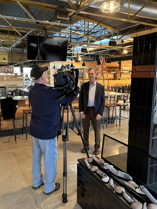 EGLE Director Phil Roos stands in front of camera sharing on the brownfield site transformations EGLE supported.