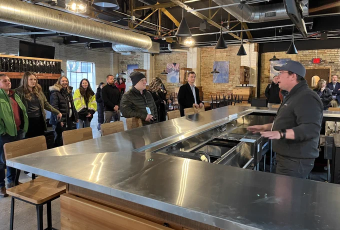 Heath Bobick, EGLE Bay City brownfield coordinator, at the North Peak site, explains the history of brownfield sites in Bay City and their transformation.