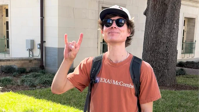 Student wearing burnt orange on campus on Longhorn Friday